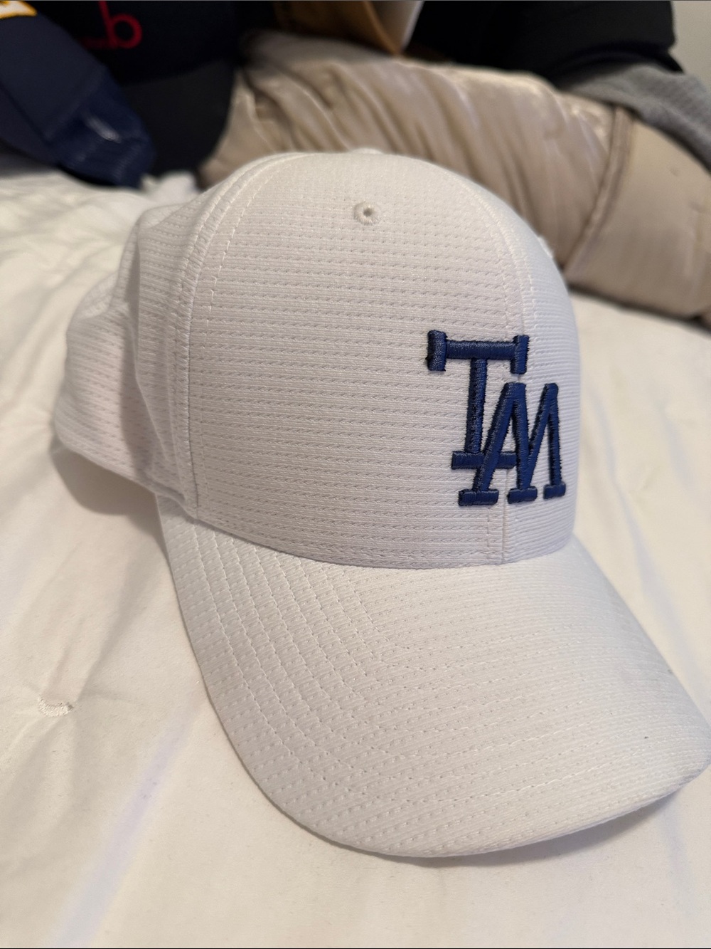 Travis Mathew White Baseball Cap with Navy 'TM' Embroidery